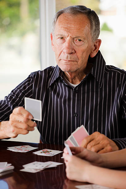 istock Senior Citizen Man Playing Cards 136855978