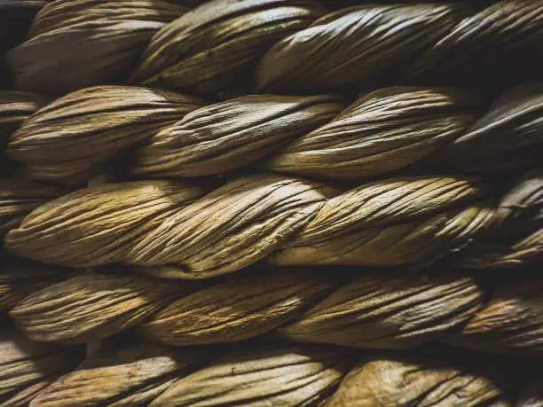 Photo of Light wood fibers braided as texture or background.