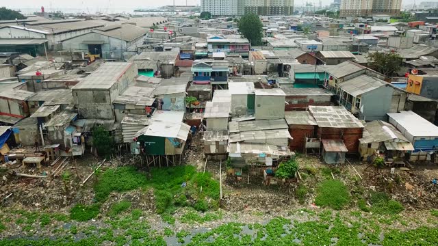 Scenery of slum homes on lakeside