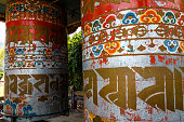 istock Vintage prayer wheels at the Khamsum Yeulley Namgyal Chorten pagoda in Punakha, Central Bhutan, Asia 1368561204