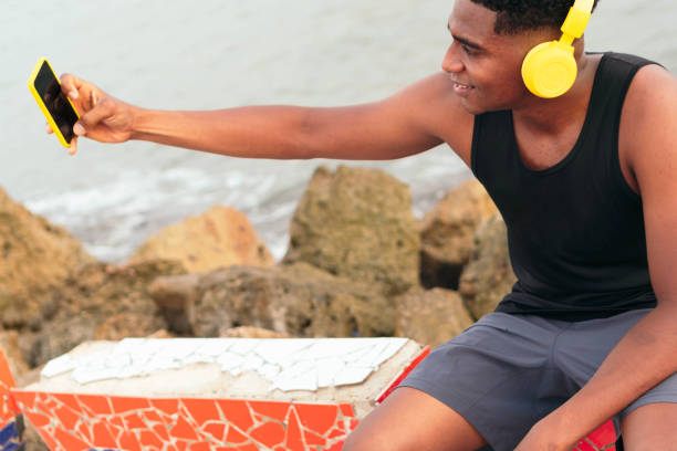 istock African man taking selfie with smartphone 1368562240