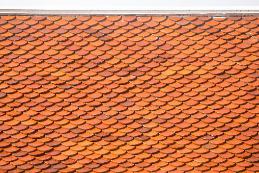 Clay Roof Tiles texture background. Weathered rusty red tiles.