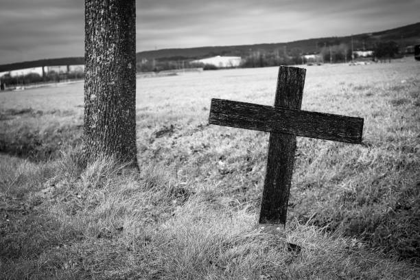 istock Road cross (accident cross) on a country road 1368566899