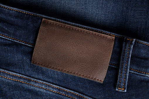Leather label on dark denim jeans. This file is cleaned and retouched.