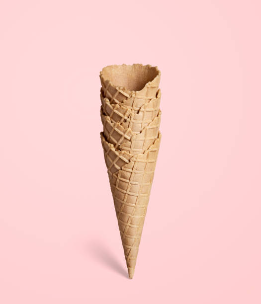 istock Ice cream waffle cone on pink background 1368568393