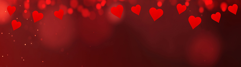 Valentine's Day Love Wedding background banner panorama - Abstract red hearts and bokeh lights on red texture, with space for text