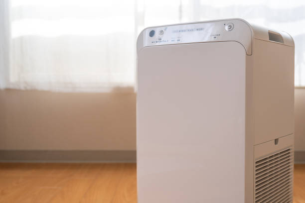 istock A white air purifier in front of windows. 1368569798