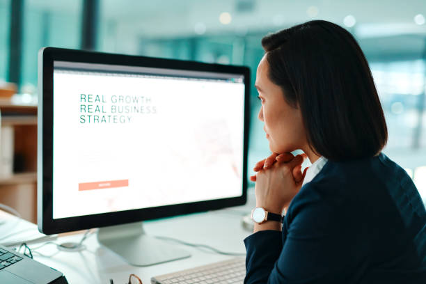 istock Shot of a young businesswoman using a computer in a modern office at work 1368572450