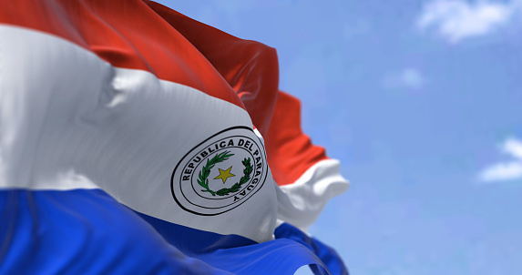 Detalle de la bandera nacional de Paraguay ondeando al viento en un día despejado photo