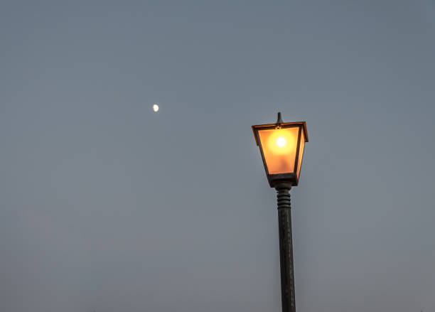 istock Street lights under the moon 1368573434