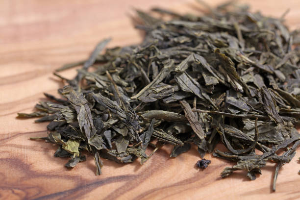 istock Green tea dried and rolled leaves 1368574933