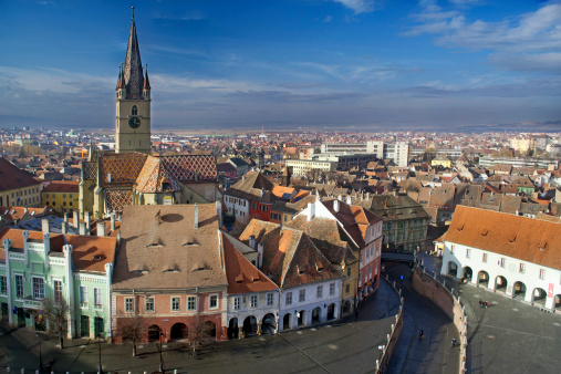 Aerial view of Sibiu old town in Transylvania, Romania, Lutheran cathedral tower and Small Square (Piata Mica)