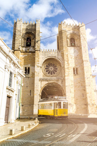 istock Yellow tramway with lisbon cathedral in the background 1368578062