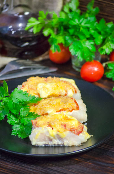 istock fish baked with vegetables and cheese in white sauce 1368578182