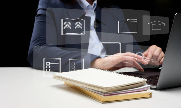 istock a woman sits at a table and works at a laptop. Remote work from home, online learning. Freelancing and online consulting 1368578267