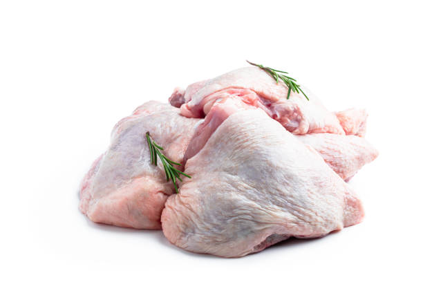 Raw chicken thighs isolated on white