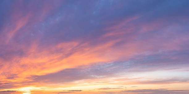 istock Vibrant color panoramic sun rise and sun set sky with cloud on a cloudy day. 1368584700
