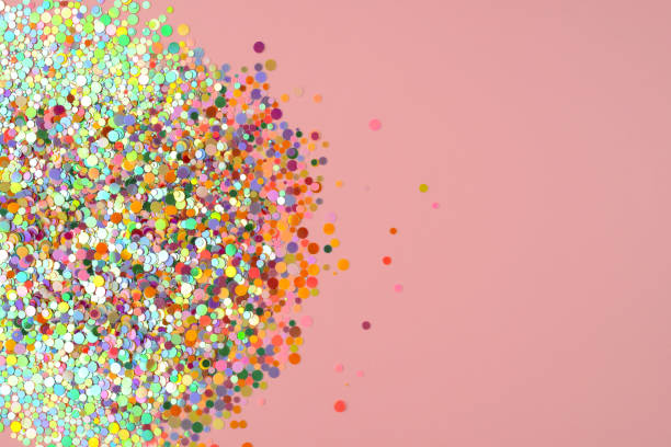 istock Colorful confetti on pink background. Cute festive background 1368584865