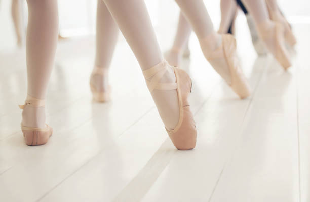 Shot of a group of unrecognizable ballet dancers during their rehearsal in a studio I am closer than I was yesterday ballet dancer feet stock pictures, royalty-free photos & images