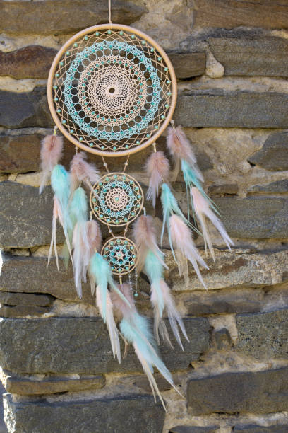 istock Handmade dream catcher with feathers threads and beads rope hanging 1368584988