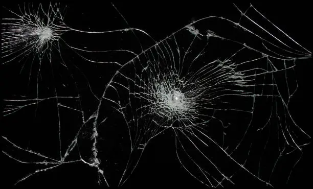 Photo of Broken glass in dark background