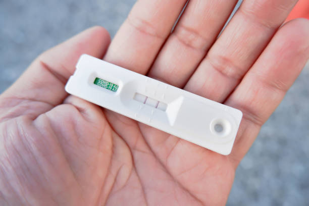 istock Covid-19 positive result cassette from a rapid antigen test kit (ATK) 1368592252