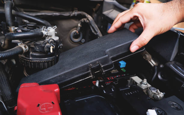 istock A mechanic hand is removing the fuse box 1368592405
