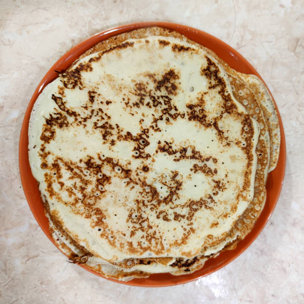 istock ruddy pancakes on a plate, top view, square photo 1368592501