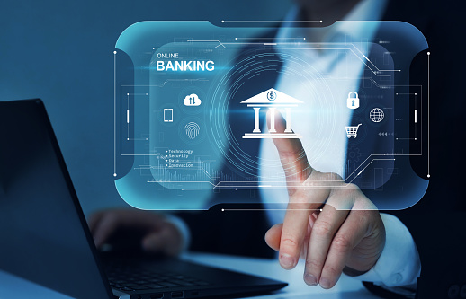 Empresario tocando pantalla virtual con icono de banca online. Concepto de pagos online, ciberseguridad y dispositivos. Tecnología de innovación digital. photo