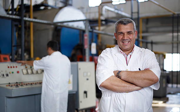 istock Happy blue collar worker in a factory 136859354