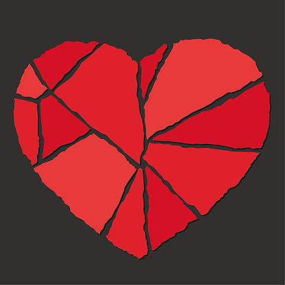 Vector broken heart made with pieces of torn papers. Red colors. Black background.