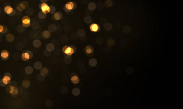 istock Light abstract glowing bokeh lights, magical dust. 1368597343