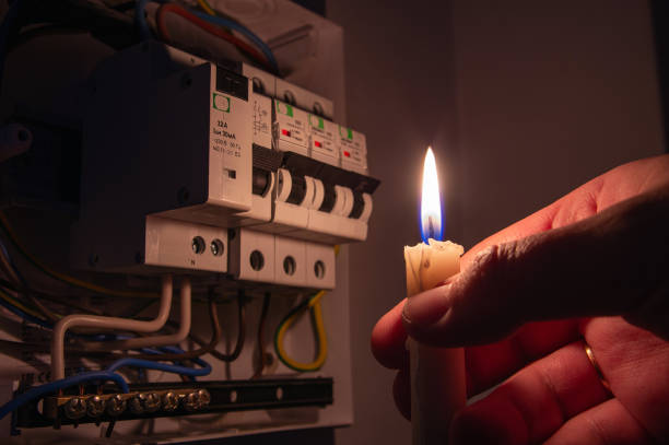 istock Burning candle near the electrical fuses. 1368598109