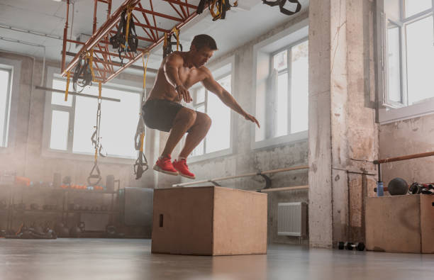 istock Sportive man performing functional training in gym 1368598416
