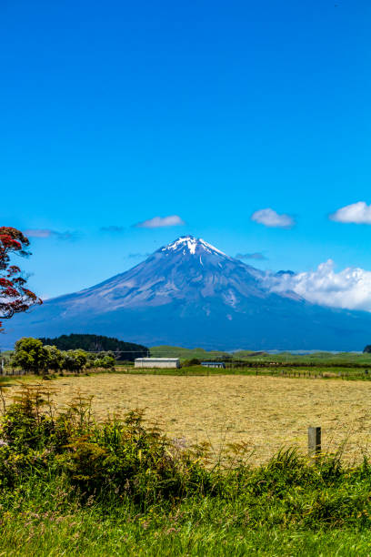istock Mount Taranaki rises towards the sky. Taranaki, New Zealand 1368600607