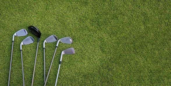 Banner of Different golf club on green grass background. sport concept.