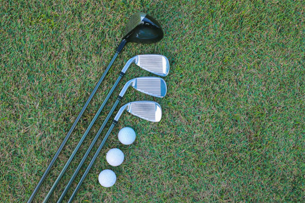 istock Different golf club on green grass background. sport concept. 1368603173