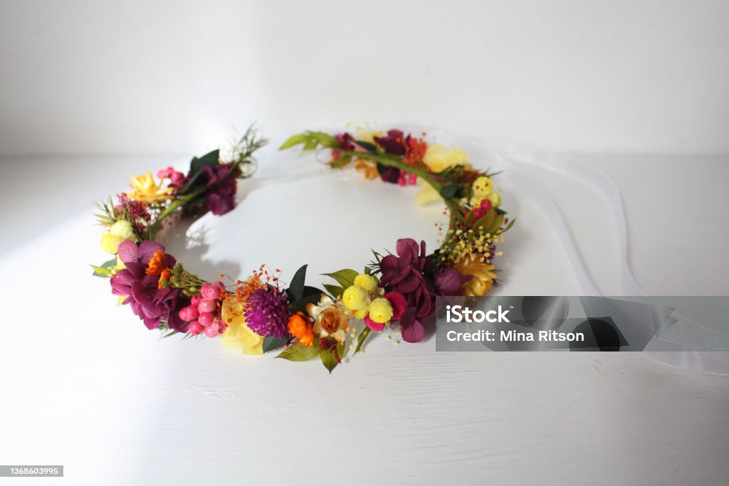 Flower crown - Vivid Summer Dried and preserved flower crown for a flower girl. Preserved flowers are real flowers which treated to last for a few years without water. Floral Crown Stock Photo