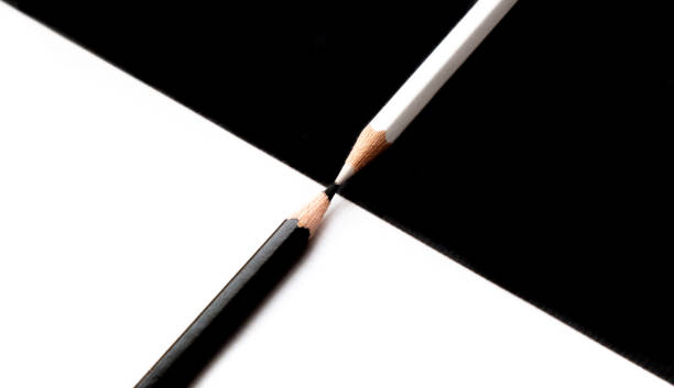 istock White and black pencils on white and black background 1368604081