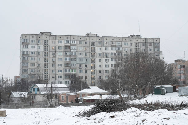 istock Old Soviet prefabricated nine-storey panel apartment building in winter. 1368605425