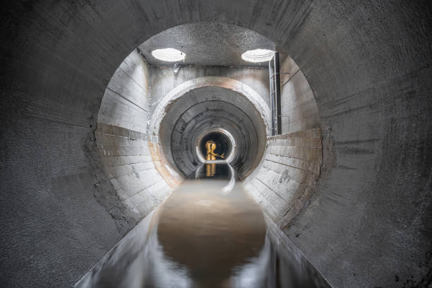 New concrete drainage rainwater collector, in a concrete pipe, inside view.