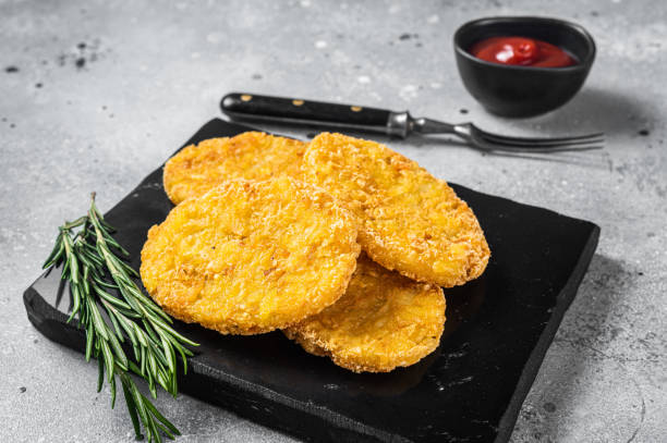 istock Hash brown potato with ketchup, hashbrown on white table. Gray background. Top view 1368606089