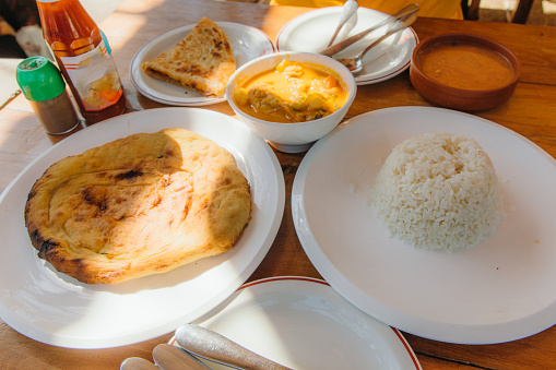 View of the Indian meal with rice and curry - traditional food of Stone Town on Zanzibar