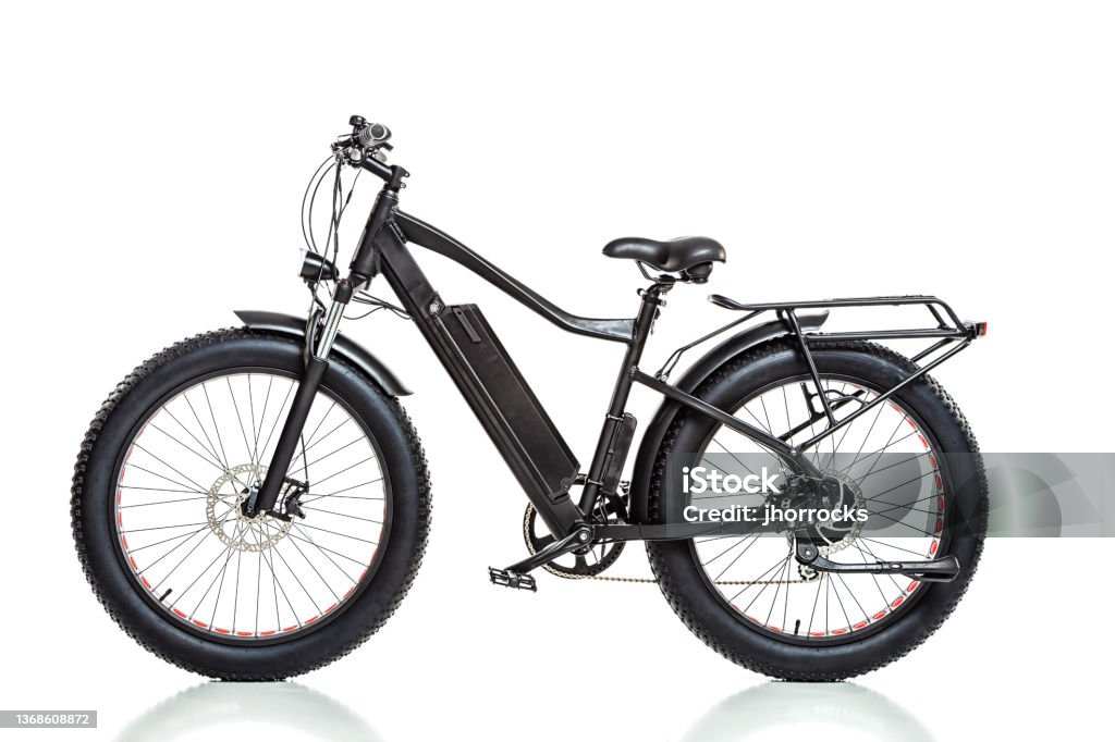 Electric Bicycle Profile Studio shot of a generic electric bicycle isolated against a white background; profile view Electric Bicycle Stock Photo