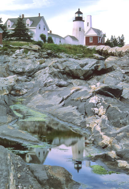 istock Reflection of lighthouse at Pemaquid Point Maine 1368611001