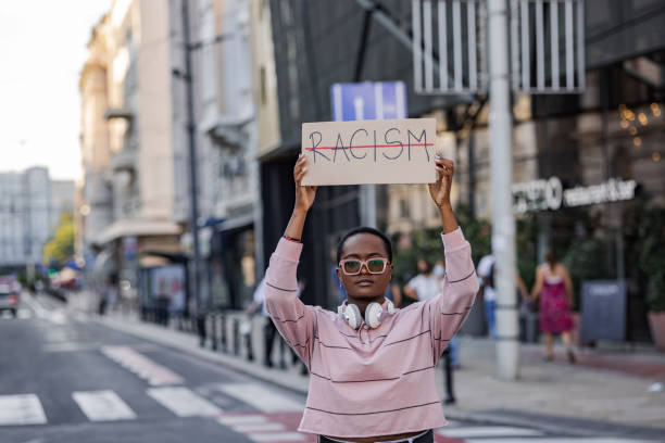 istock Woman on the street, protesting against racism 1368611595