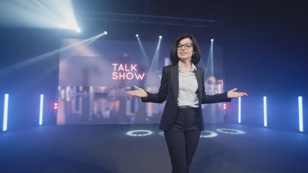 istock Cheerful host starting evening talk show 1368611674