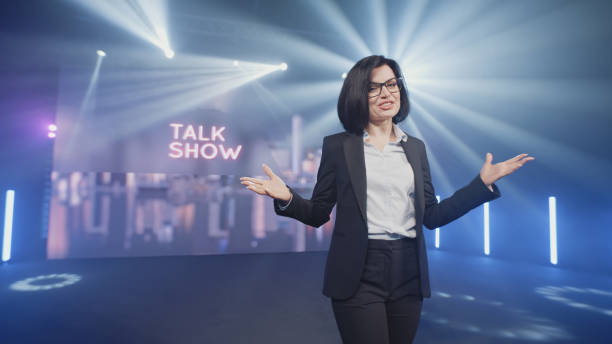 istock Cheerful host starting evening talk show 1368612396