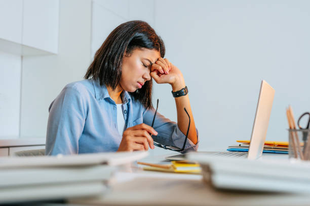 istock Young beautiful woman working using laptop feeling overworked 1368613118