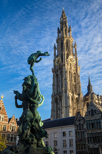 Brabo's Monument (Brabomonument) and the Cathedral of Our Lady in Antwerp, Belgium.